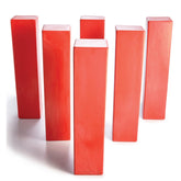 A cluster of red blocks arranged on a clean white surface.